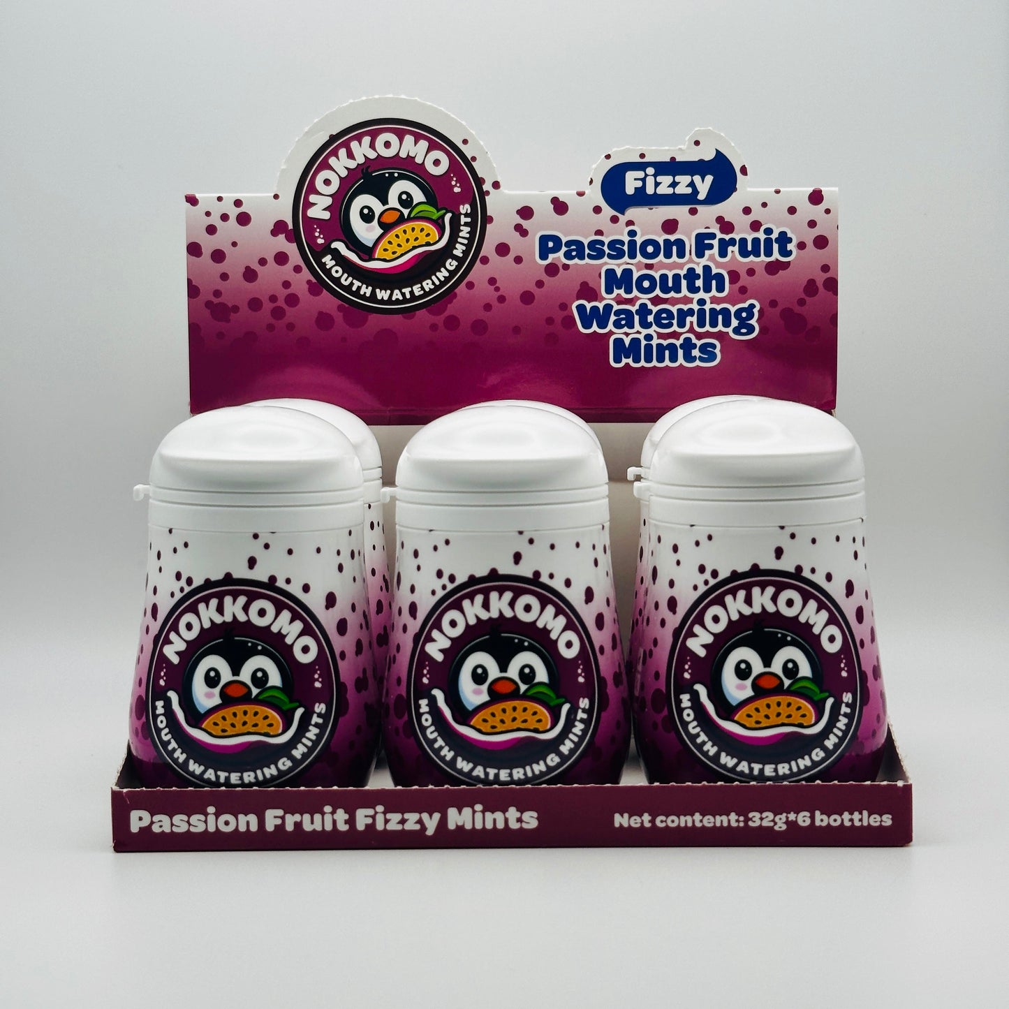 Six bottles of Passion Fruit flavored Nokkomo Mints for dry mouth relief and fresh breath in portable containers.