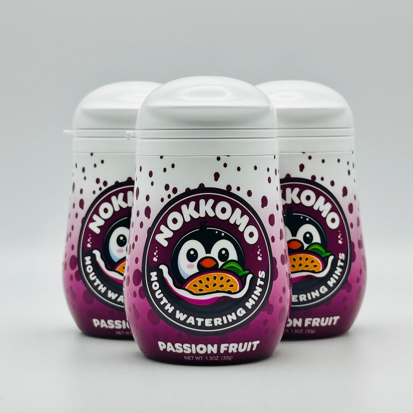 Three bottles of Passion Fruit flavored Nokkomo Mints for dry mouth relief and fresh breath in portable containers.