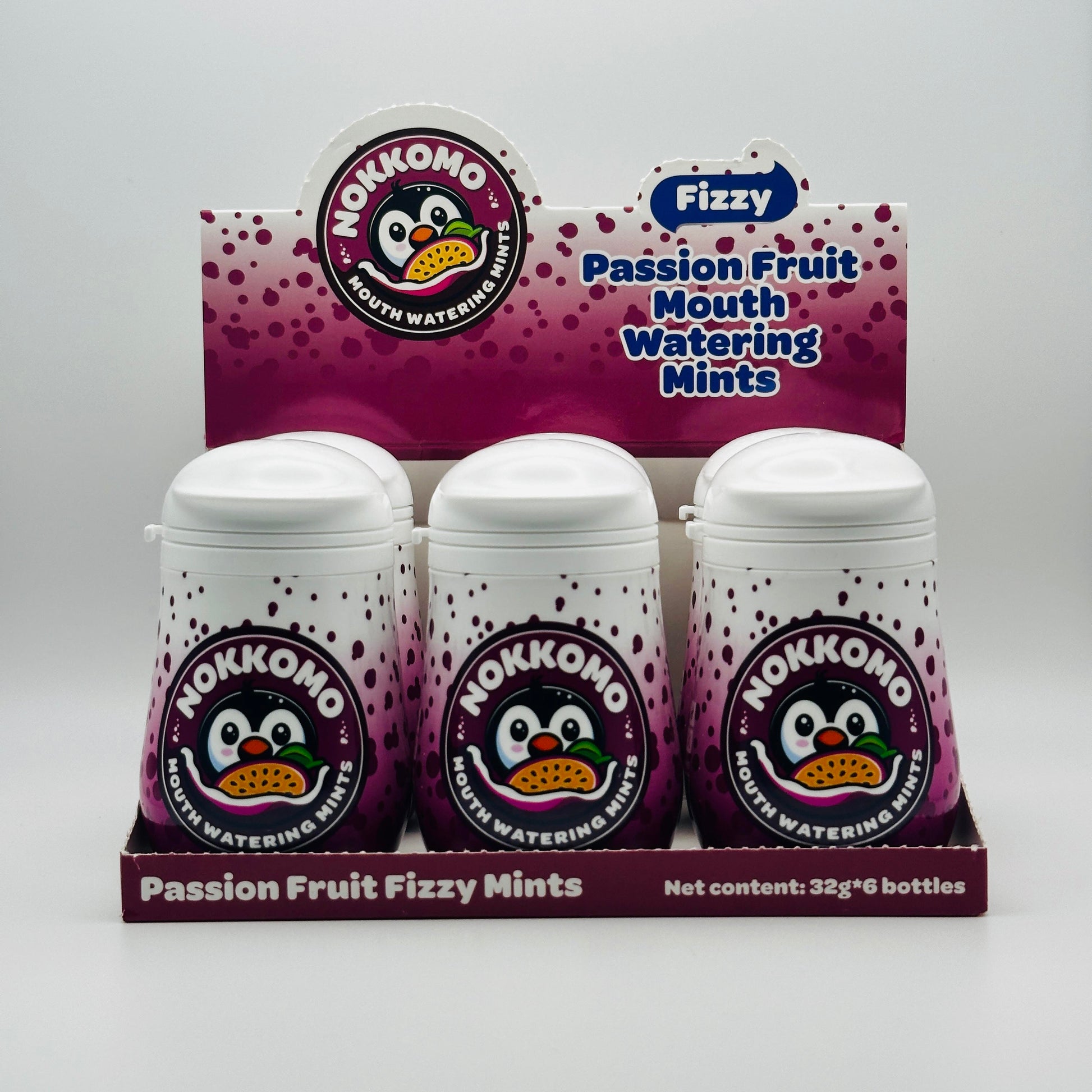 Six bottles of Passion Fruit flavored Nokkomo Mints for dry mouth relief and fresh breath in portable containers.